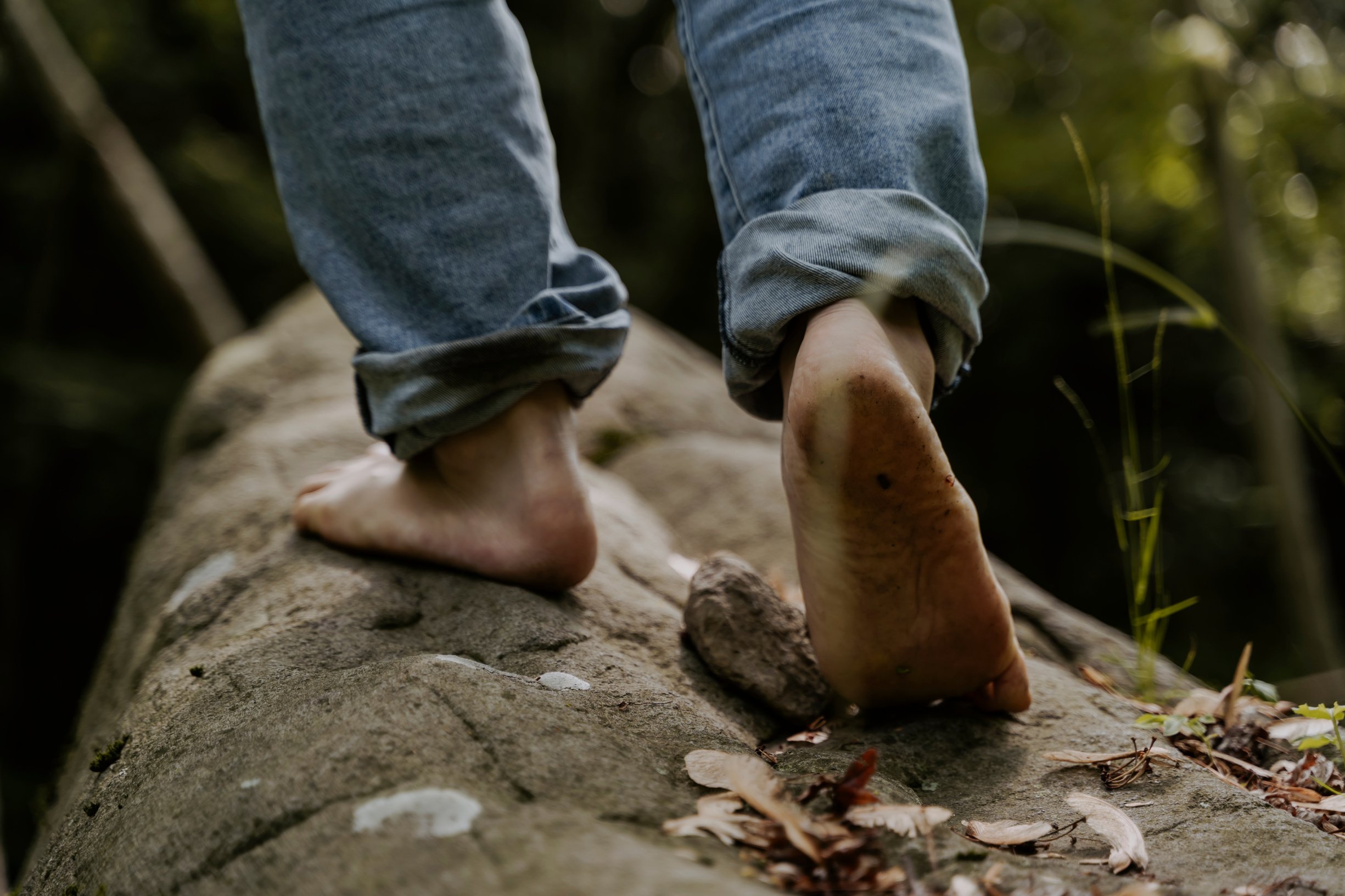 Person Walking Barefoot in Forest